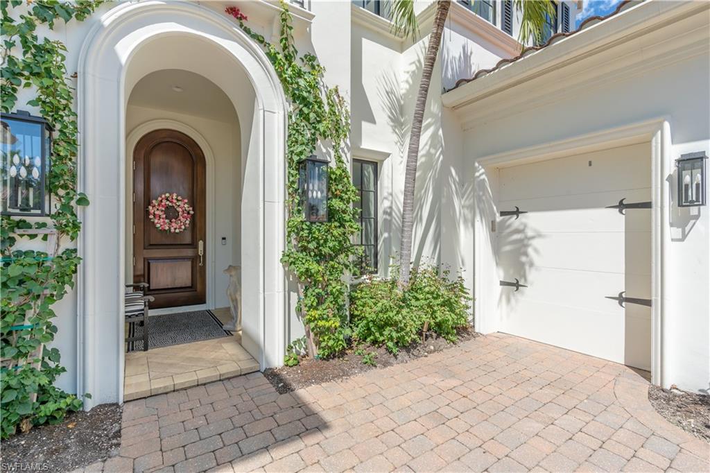 2125 Modena Court Naples, FL 34105 - Photo 3 of 50 a view of a entrance of the house