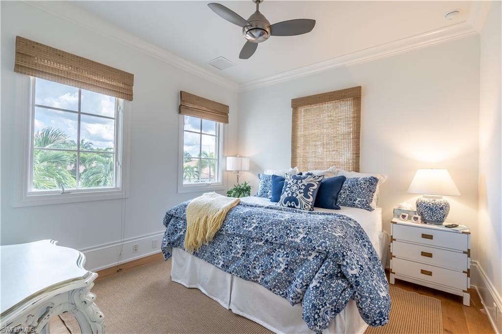 2125 Modena Court Naples, FL 34105 - Photo 32 of 50 a bedroom with a bed and window