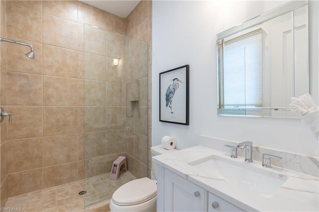 2125 Modena Court Naples, FL 34105 - Photo 35 of 50 a bathroom with a sink toilet and shower