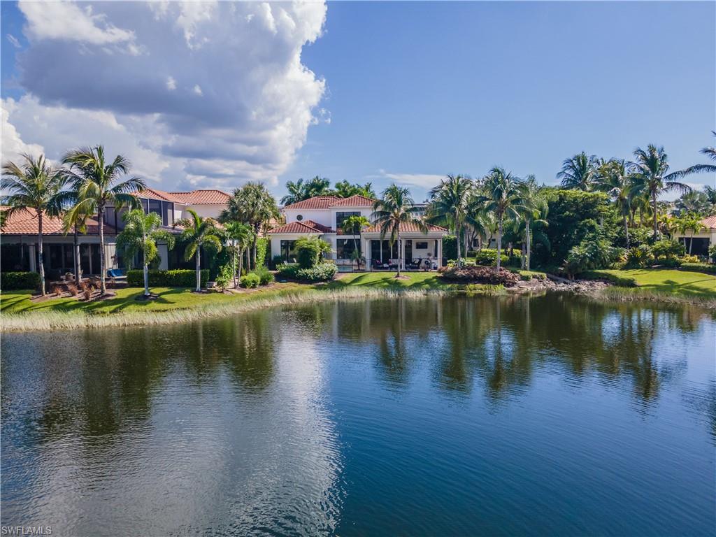 2125 Modena Court Naples, FL 34105 - Photo 37 of 50 a view of residential house with outdoor space and lake