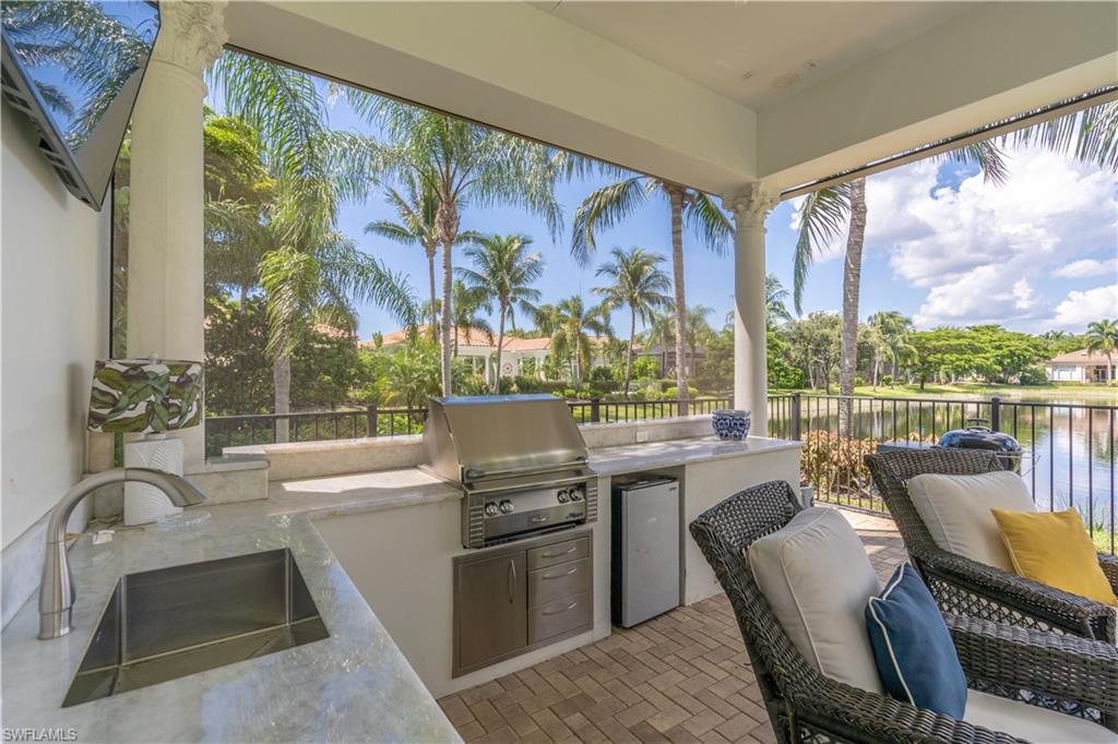 2125 Modena Court Naples, FL 34105 - Photo 39 of 50 a view of a kitchen with a large window