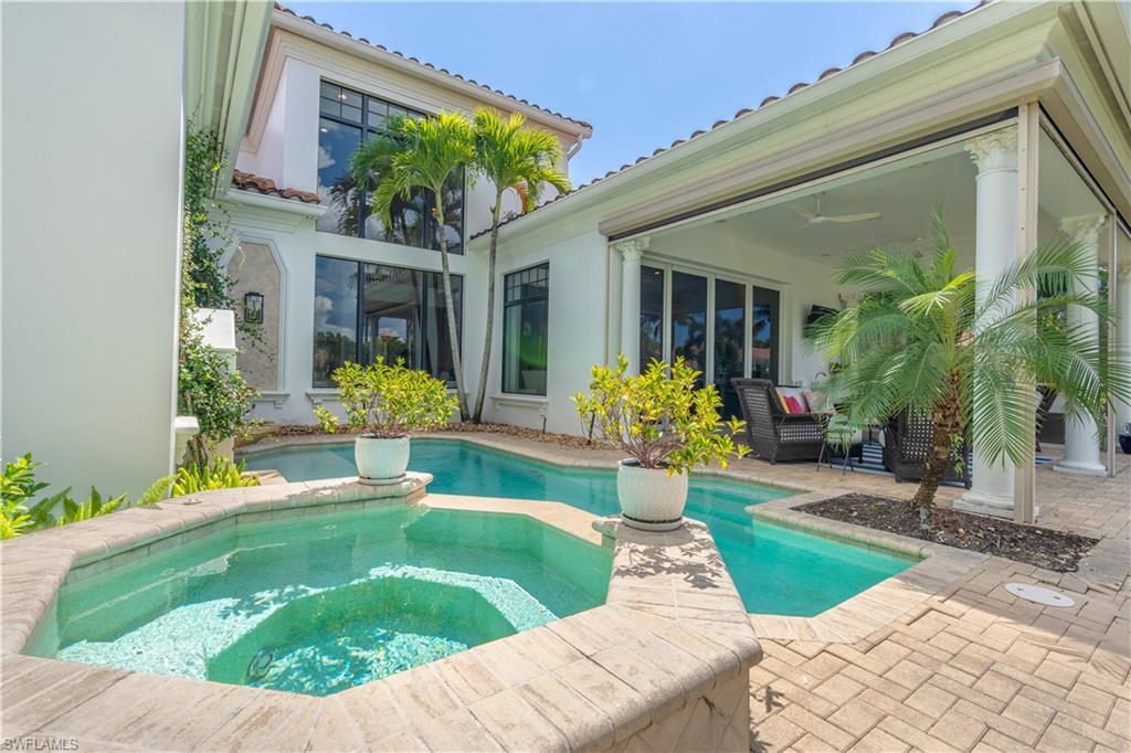 2125 Modena Court Naples, FL 34105 - Photo 40 of 50 a view of a house with porch and sitting area