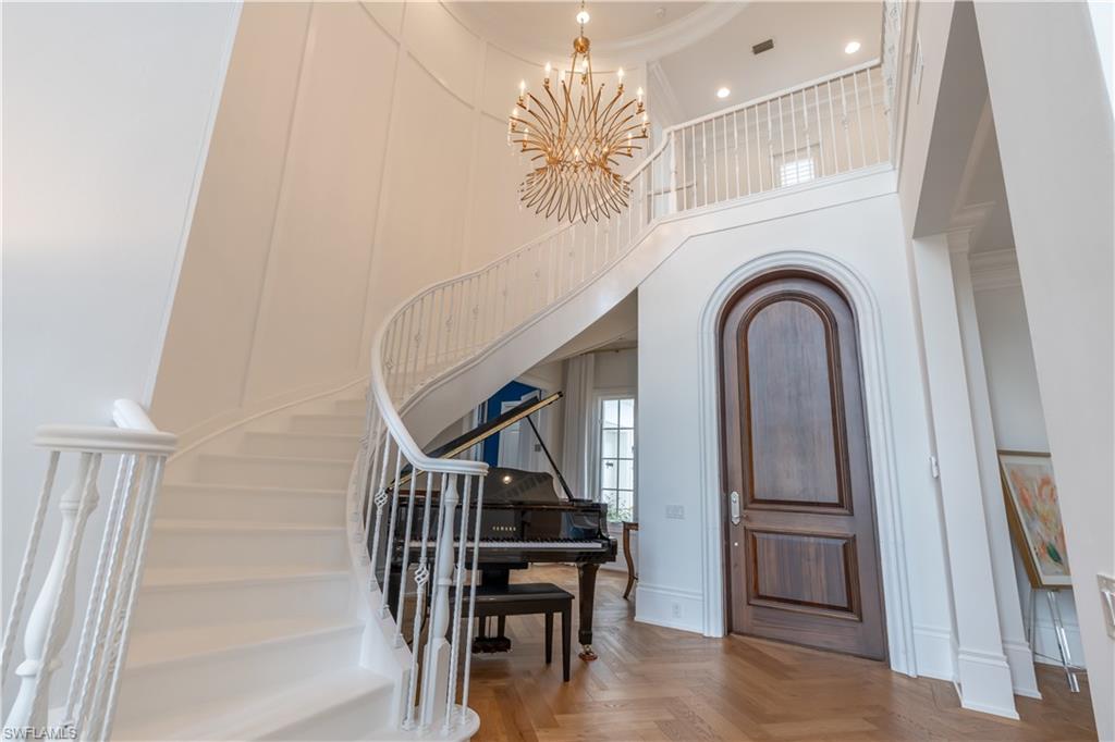 2125 Modena Court Naples, FL 34105 - Photo 4 of 50 a view of entryway and hall with wooden floor