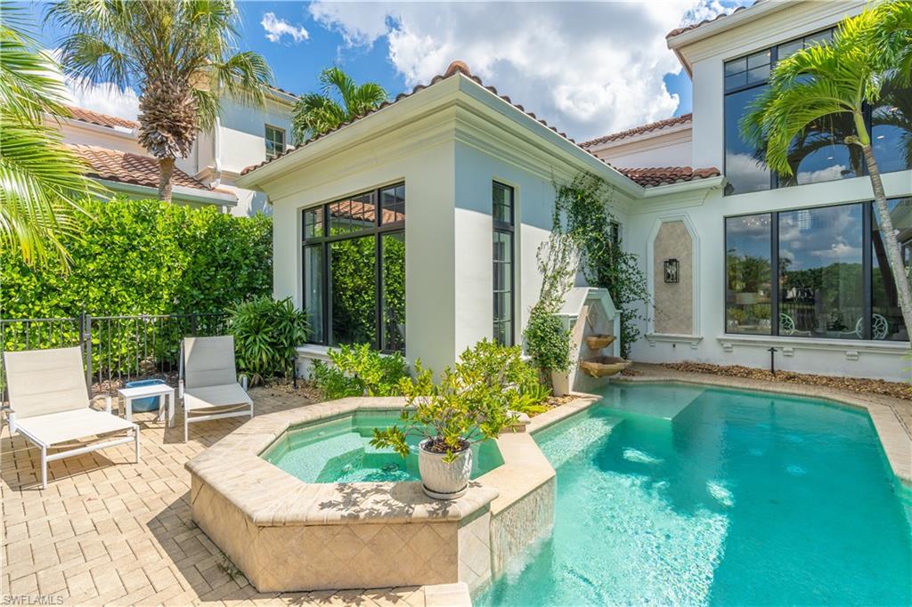 2125 Modena Court Naples, FL 34105 - Photo 41 of 50 a front view of a house with garden