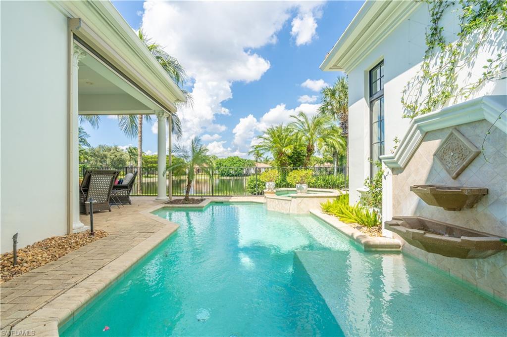 2125 Modena Court Naples, FL 34105 - Photo 42 of 50 a view of a swimming pool with a patio