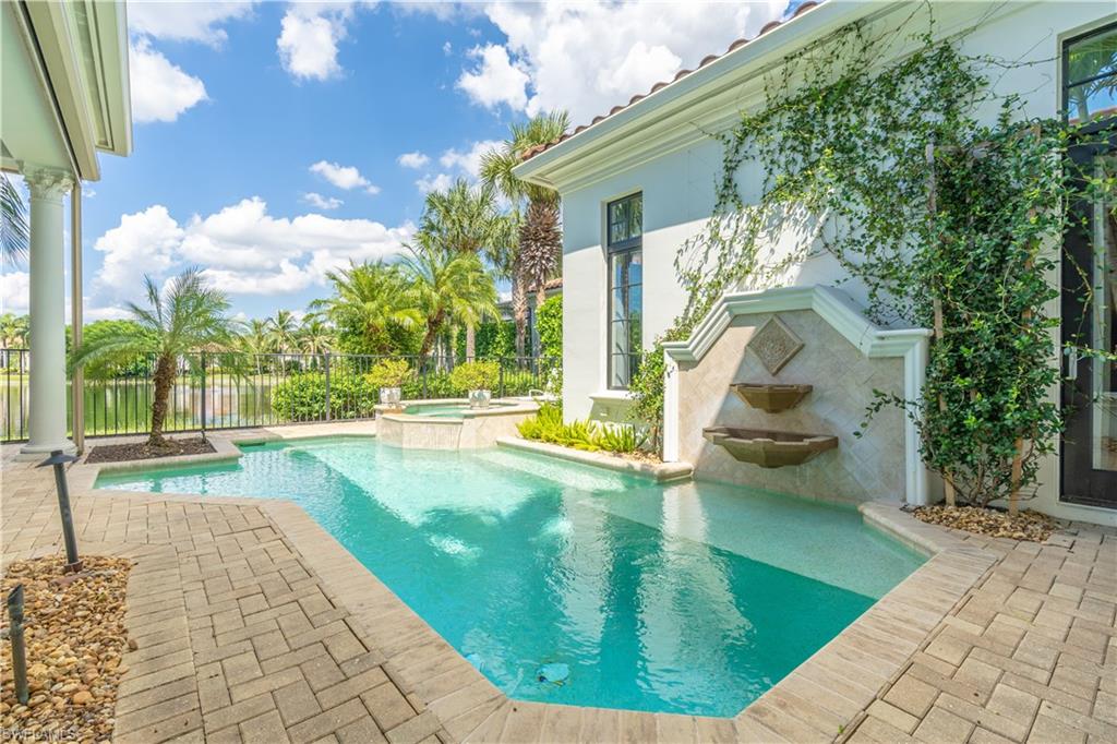 2125 Modena Court Naples, FL 34105 - Photo 44 of 50 a view of a swimming pool with a sitting space