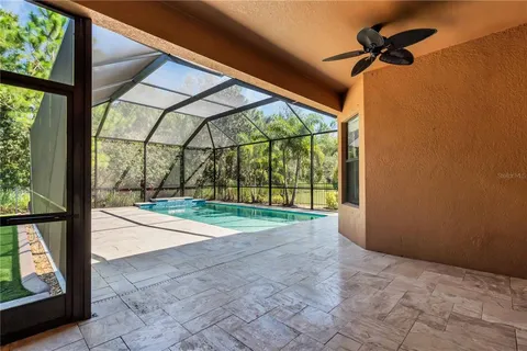 an aerial view of a house with a swimming pool