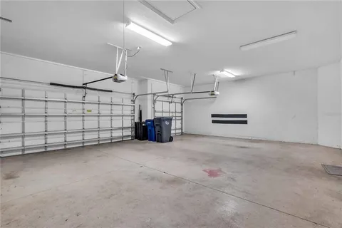 a kitchen with a table and chairs in it