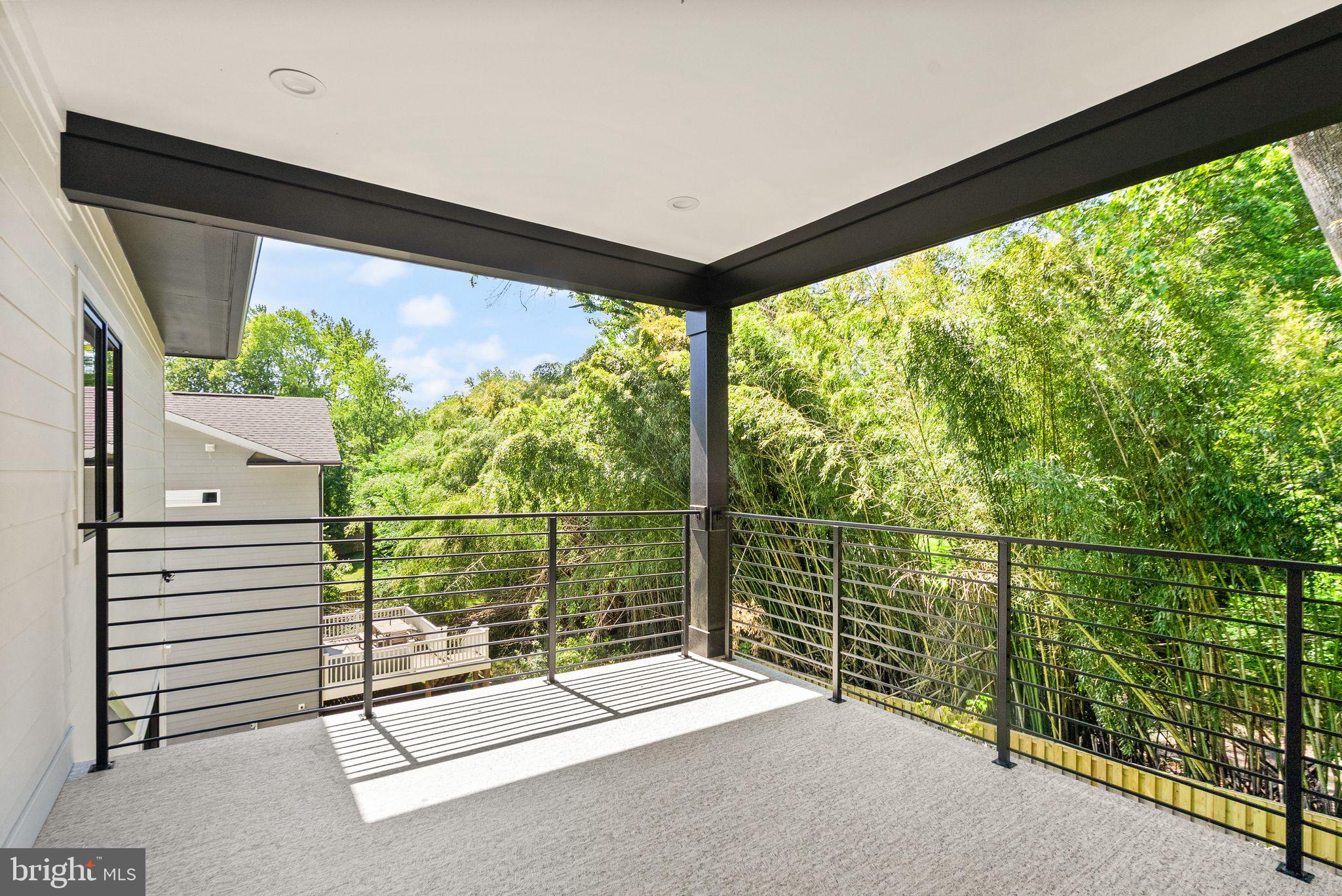 6329 Halsey Road McLean, VA 22101 - Photo 46 of 94 Serene balcony with lush greenery views.