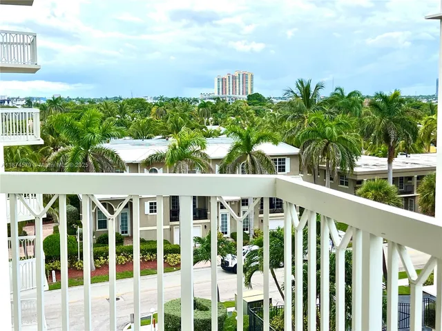 a view of a brick house with a yard