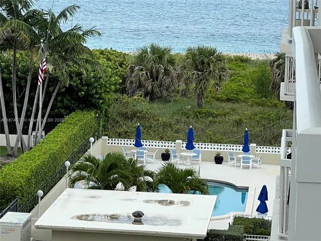 a view of yard with swimming pool and outdoor seating