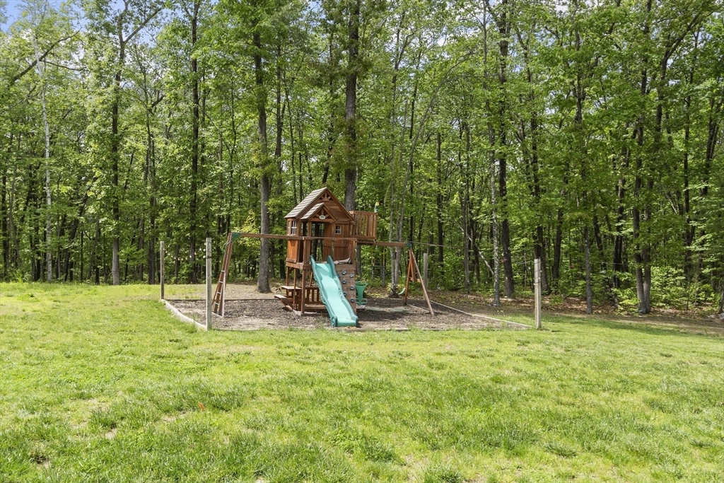 79 Tyler Road Townsend, MA 01469 - Photo 11 of 42 a childrens park with lots of swings and slides