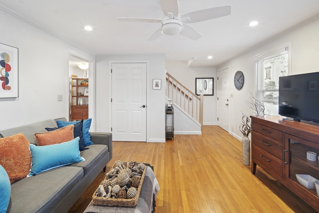 120 Medford Street, Unit 120 Arlington, MA 02474 - Photo 3 of 25 a living room with furniture and a flat screen tv