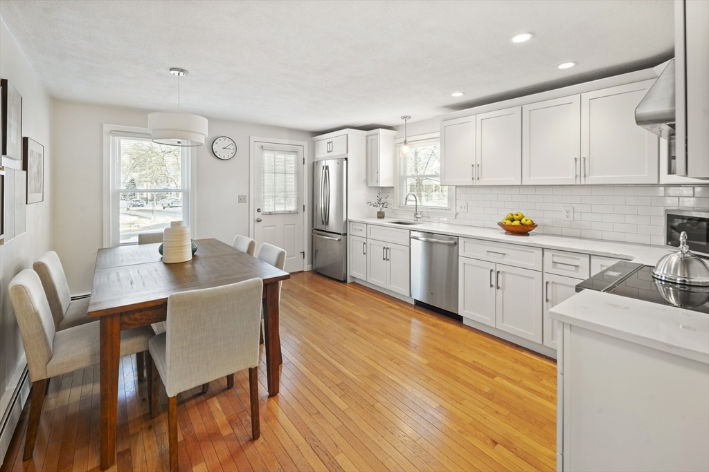 120 Medford Street, Unit 120 Arlington, MA 02474 - Photo 6 of 25 a view of kitchen with a table and chairs in it