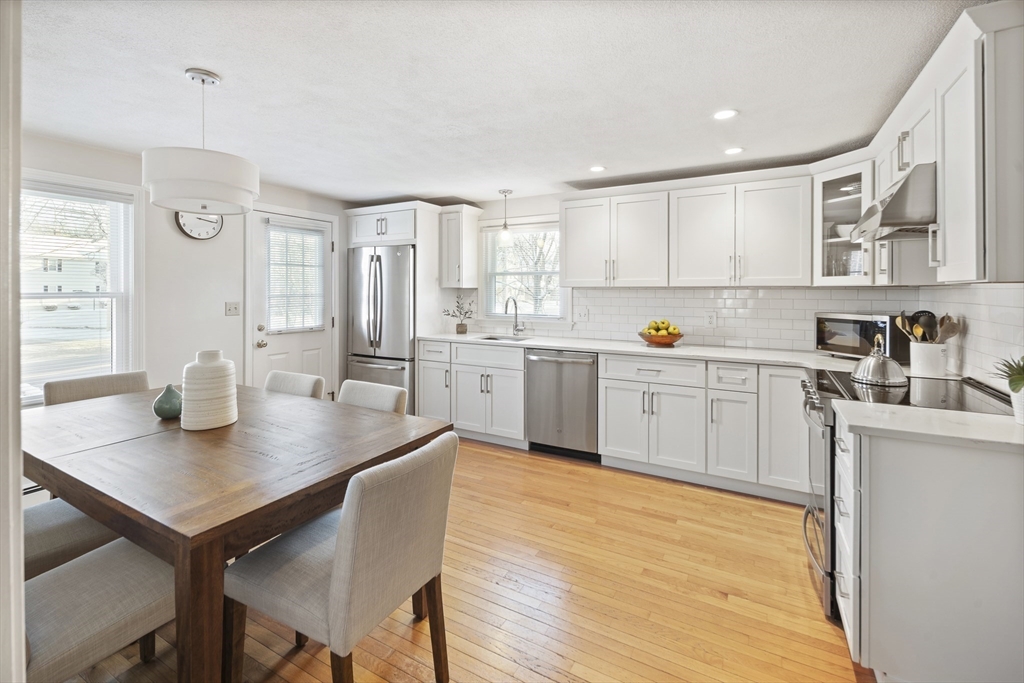 120 Medford Street, Unit 120 Arlington, MA 02474 - Photo 8 of 25 a kitchen with a sink cabinets and wooden floor