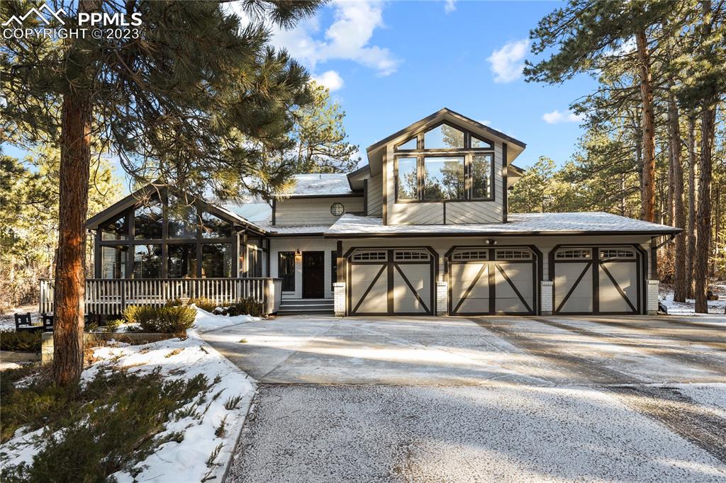 a view of house with outdoor space and sitting area