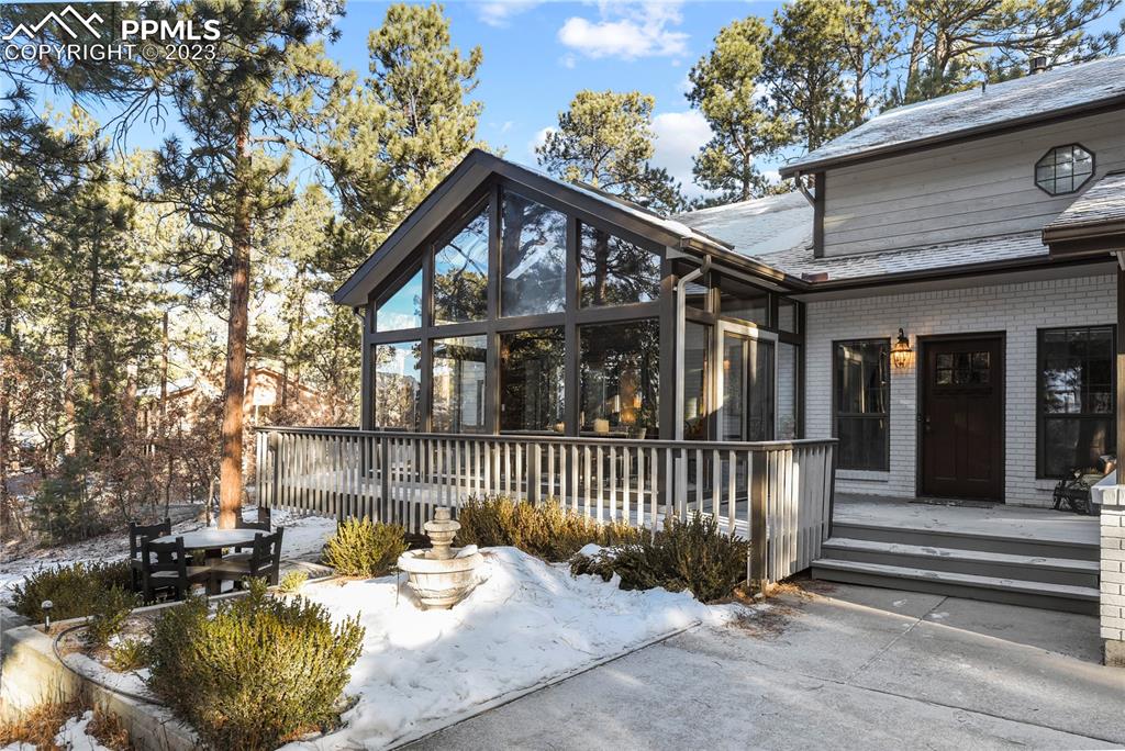 450 Jack Boot Road Monument, CO 80132 - Photo 2 of 45 a view of a house with a chairs in patio
