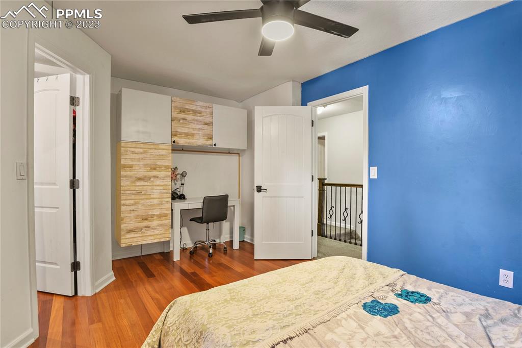 450 Jack Boot Road Monument, CO 80132 - Photo 28 of 45 a bedroom with bed and wooden floor