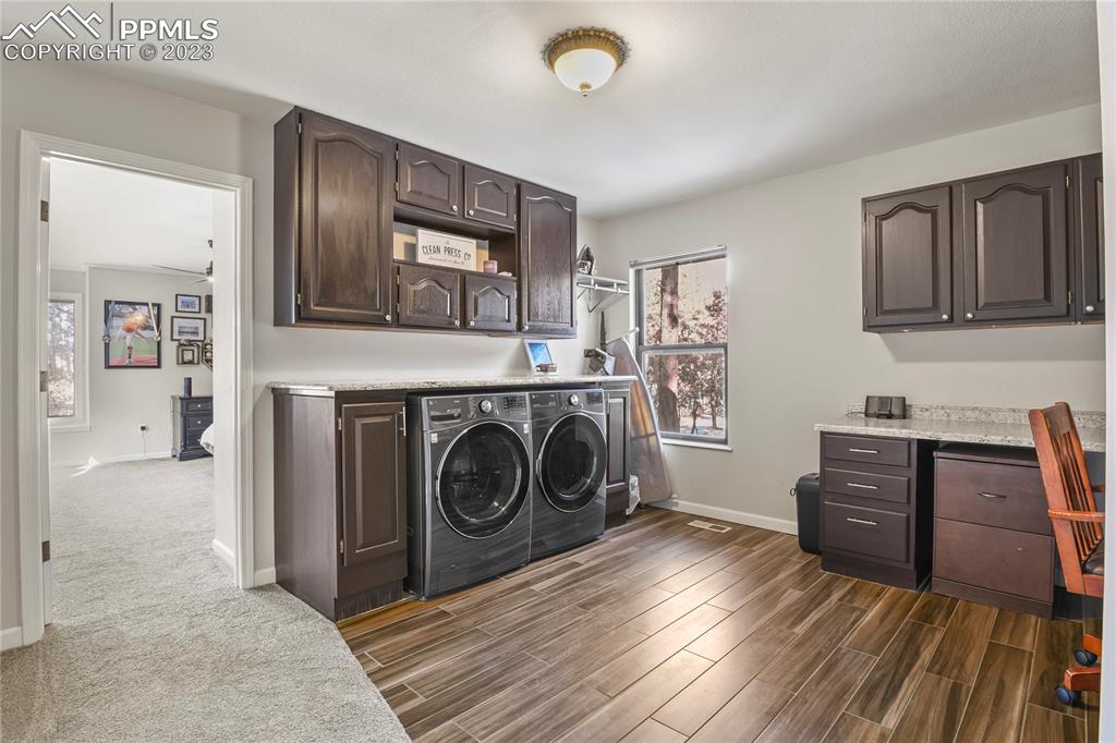 450 Jack Boot Road Monument, CO 80132 - Photo 31 of 45 a view of a livingroom with washer and dryer