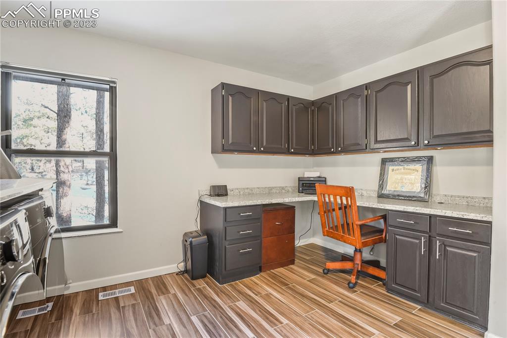 450 Jack Boot Road Monument, CO 80132 - Photo 32 of 45 a workspace with cabinets