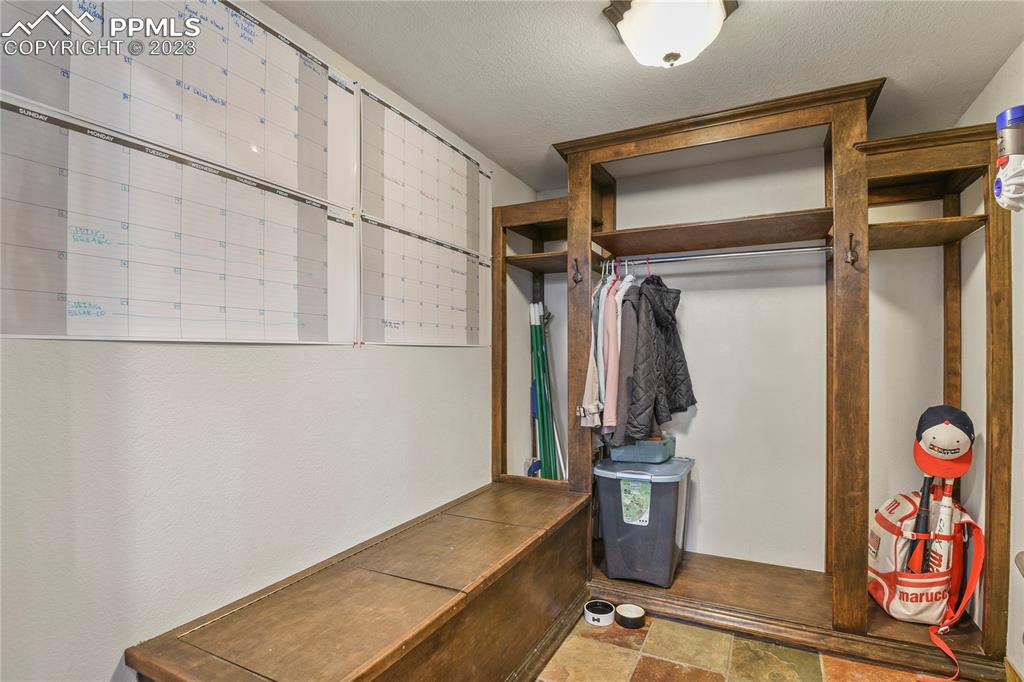 450 Jack Boot Road Monument, CO 80132 - Photo 4 of 45 a view of walk in closet with clothes and shoes