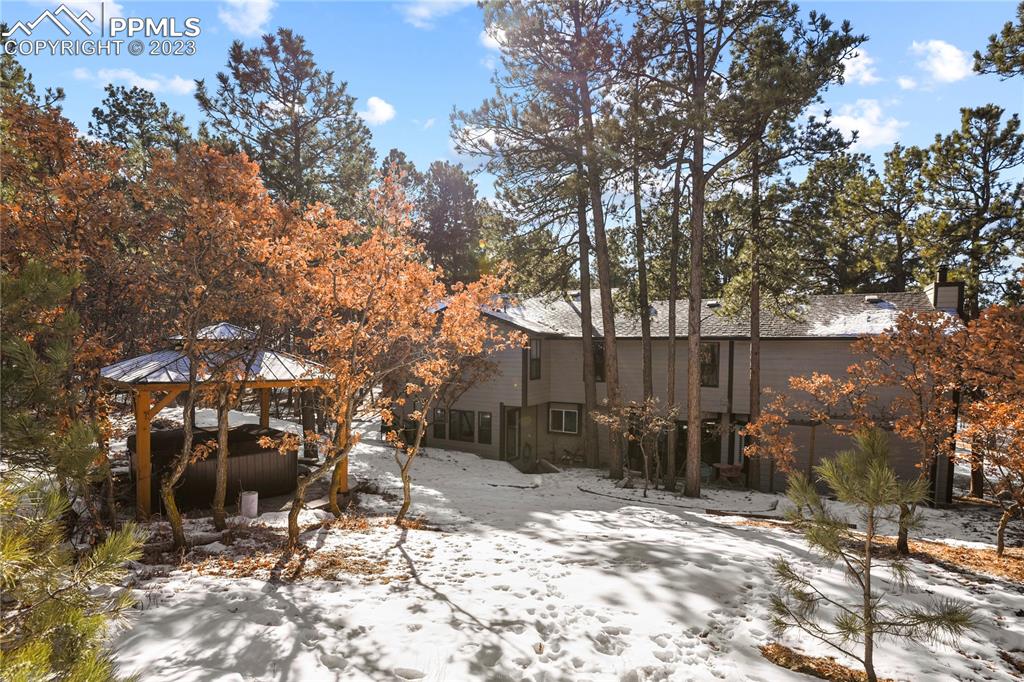 450 Jack Boot Road Monument, CO 80132 - Photo 43 of 45 a backyard of a house with table and chairs