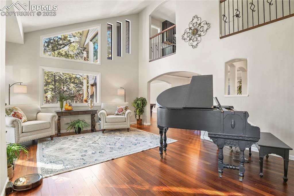 450 Jack Boot Road Monument, CO 80132 - Photo 5 of 45 a living room with furniture and wooden floor
