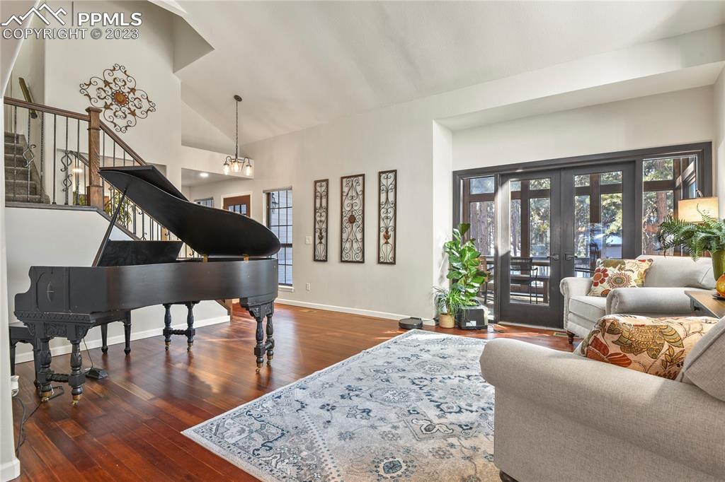 450 Jack Boot Road Monument, CO 80132 - Photo 6 of 45 a living room with furniture and wooden floor