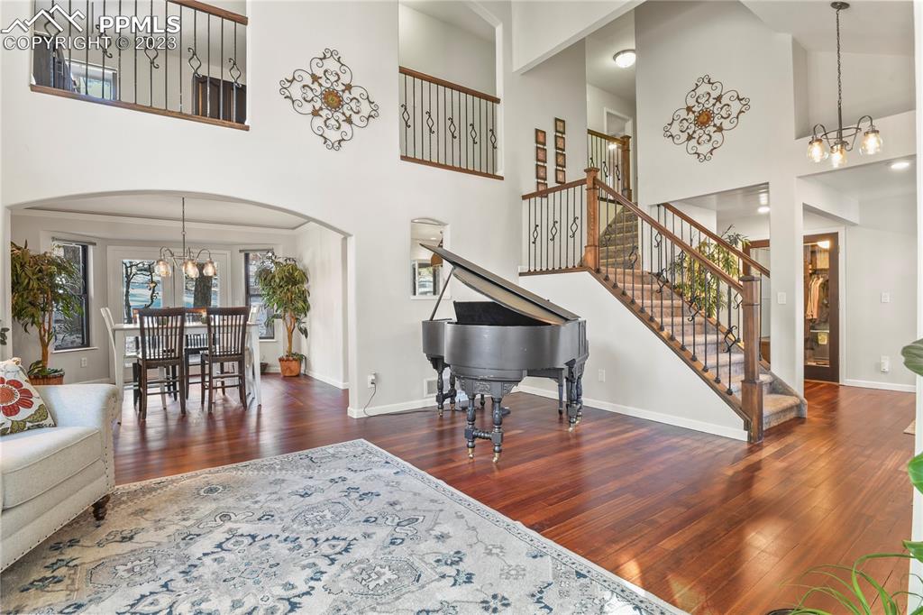 450 Jack Boot Road Monument, CO 80132 - Photo 7 of 45 a view of a dining room with furniture wooden floor and a chandelier