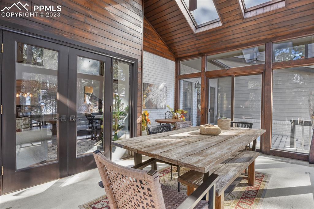450 Jack Boot Road Monument, CO 80132 - Photo 9 of 45 a living room with furniture a table and chairs