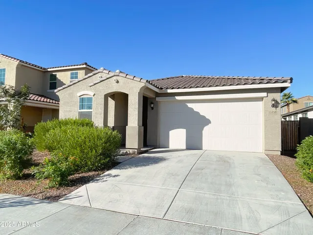 a front view of a house with a garage