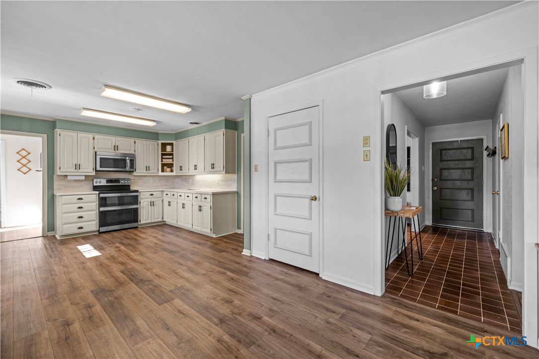 2601 Linwood Road Temple, TX 76502 - Photo 14 of 41 a open kitchen with cabinets and a stove