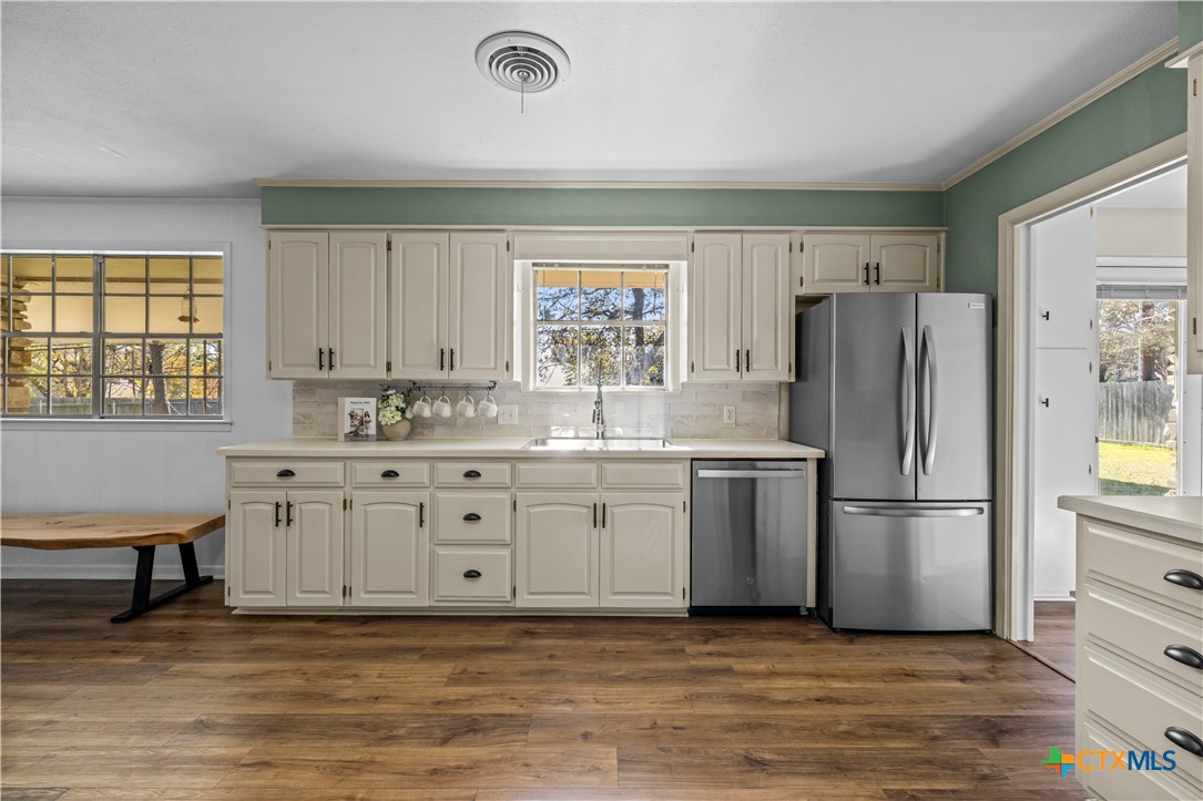 2601 Linwood Road Temple, TX 76502 - Photo 17 of 41 a kitchen with granite countertop a refrigerator sink and cabinets