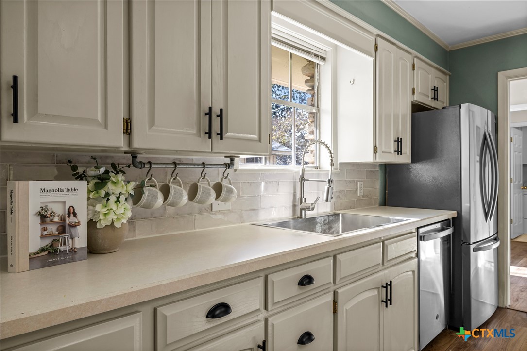 2601 Linwood Road Temple, TX 76502 - Photo 18 of 41 a kitchen with a sink and a refrigerator