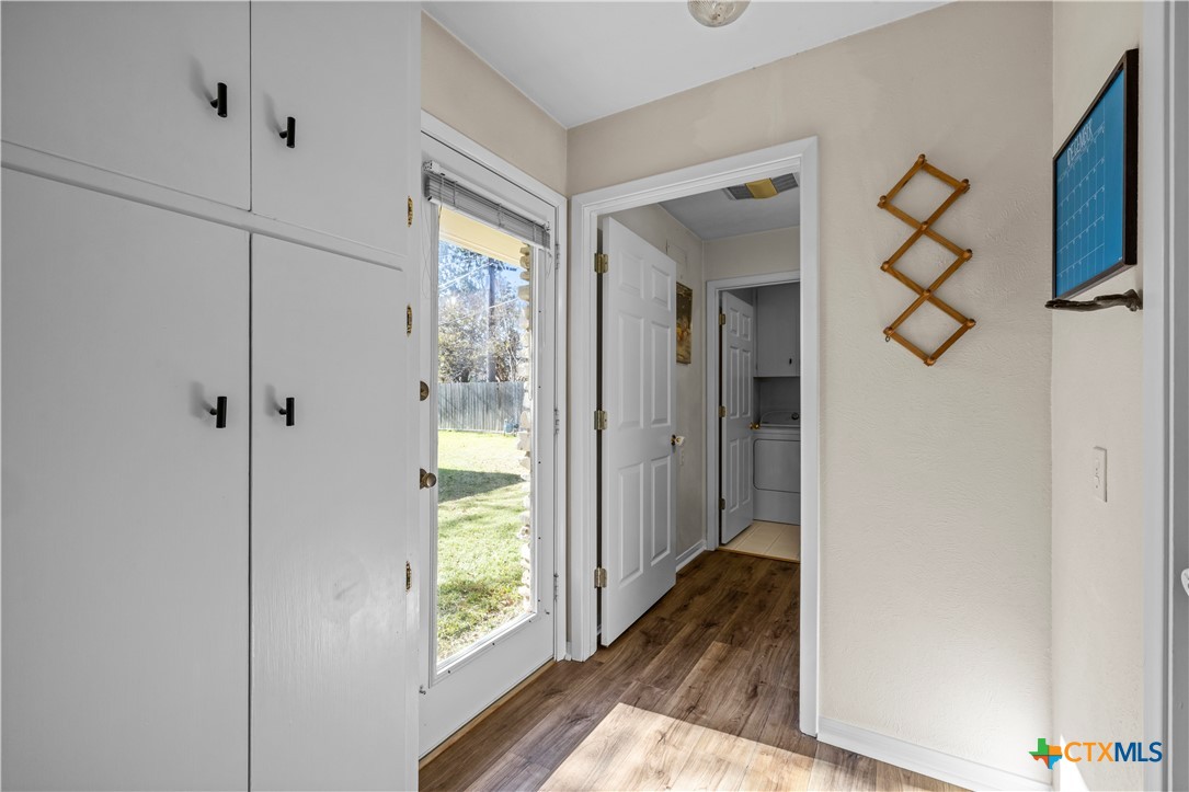 2601 Linwood Road Temple, TX 76502 - Photo 20 of 41 a view of a hallway with wooden floor and a bathroom