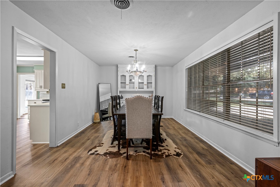 2601 Linwood Road Temple, TX 76502 - Photo 6 of 41 a view of a dining room with furniture window and wooden floor