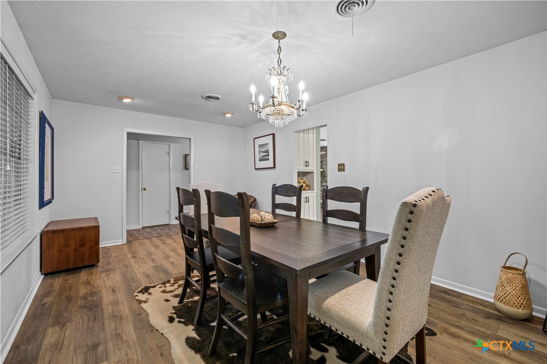 2601 Linwood Road Temple, TX 76502 - Photo 8 of 41 a view of a dining room with furniture and wooden floor