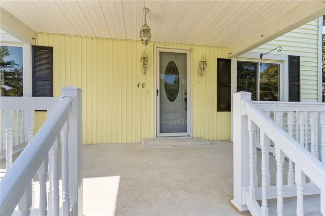 a view of a hallway with windows