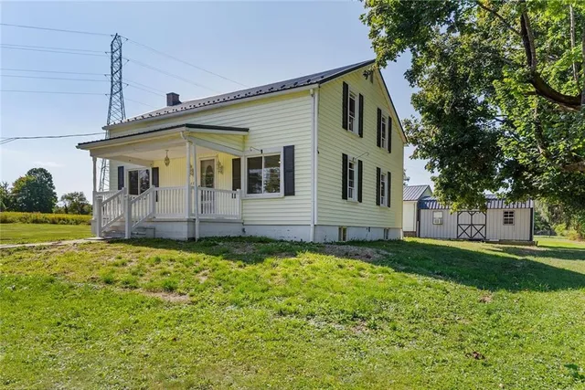 a view of a house with a yard