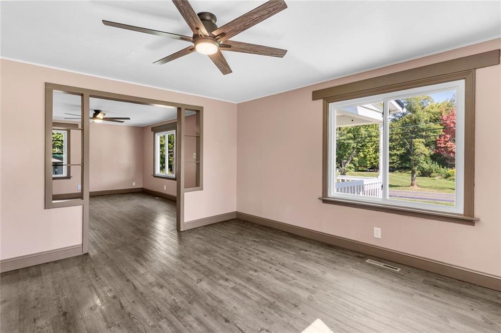 48 Kinsman Road Greenville, PA 16125 - Photo 18 of 42 a view of an empty room with window and wooden floor