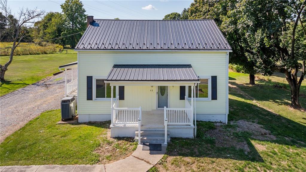 48 Kinsman Road Greenville, PA 16125 - Photo 2 of 42 a front view of a house with garden