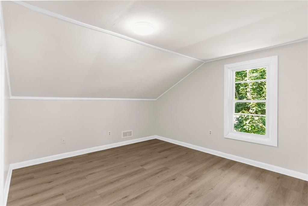 48 Kinsman Road Greenville, PA 16125 - Photo 29 of 42 an empty room with wooden floor and windows