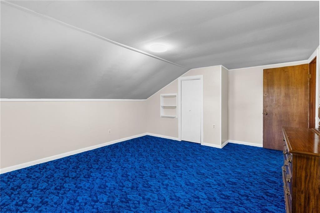 48 Kinsman Road Greenville, PA 16125 - Photo 32 of 42 a view of an empty room with wooden floor and a window