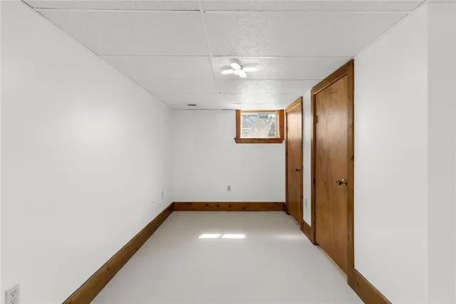an empty room with a empty space and windows