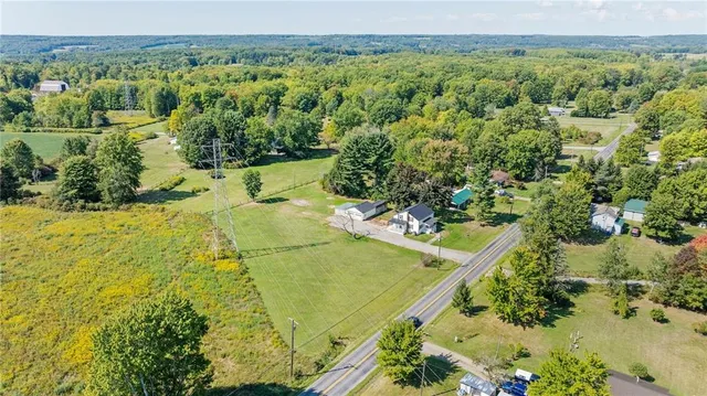 a view of a yard with an outdoor seating