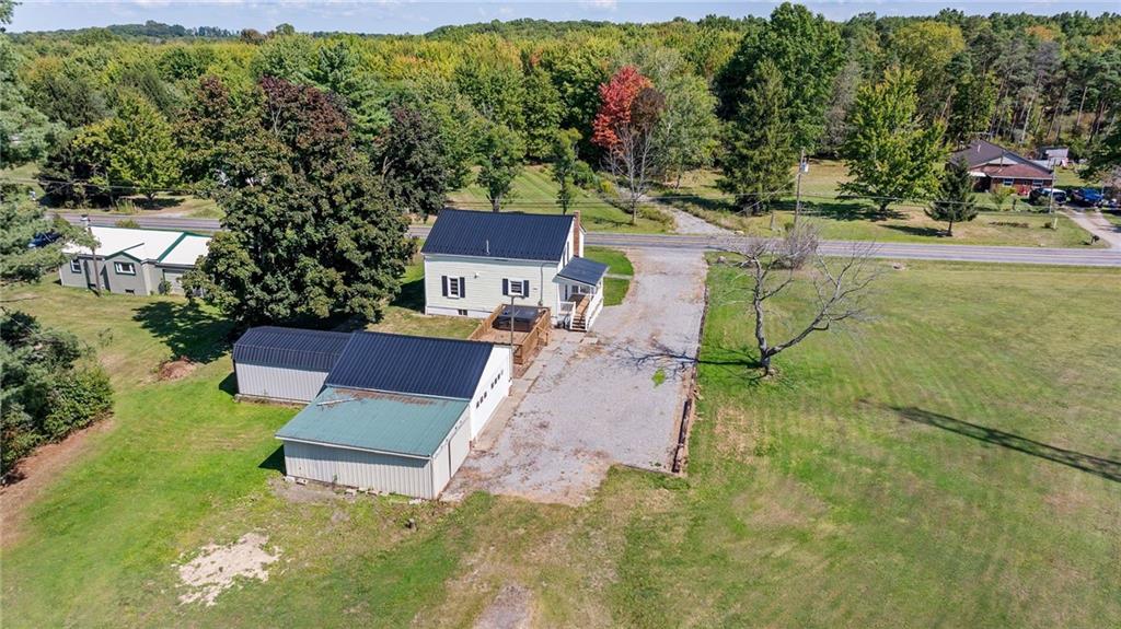 48 Kinsman Road Greenville, PA 16125 - Photo 9 of 42 a view of a chairs and table in the backyard