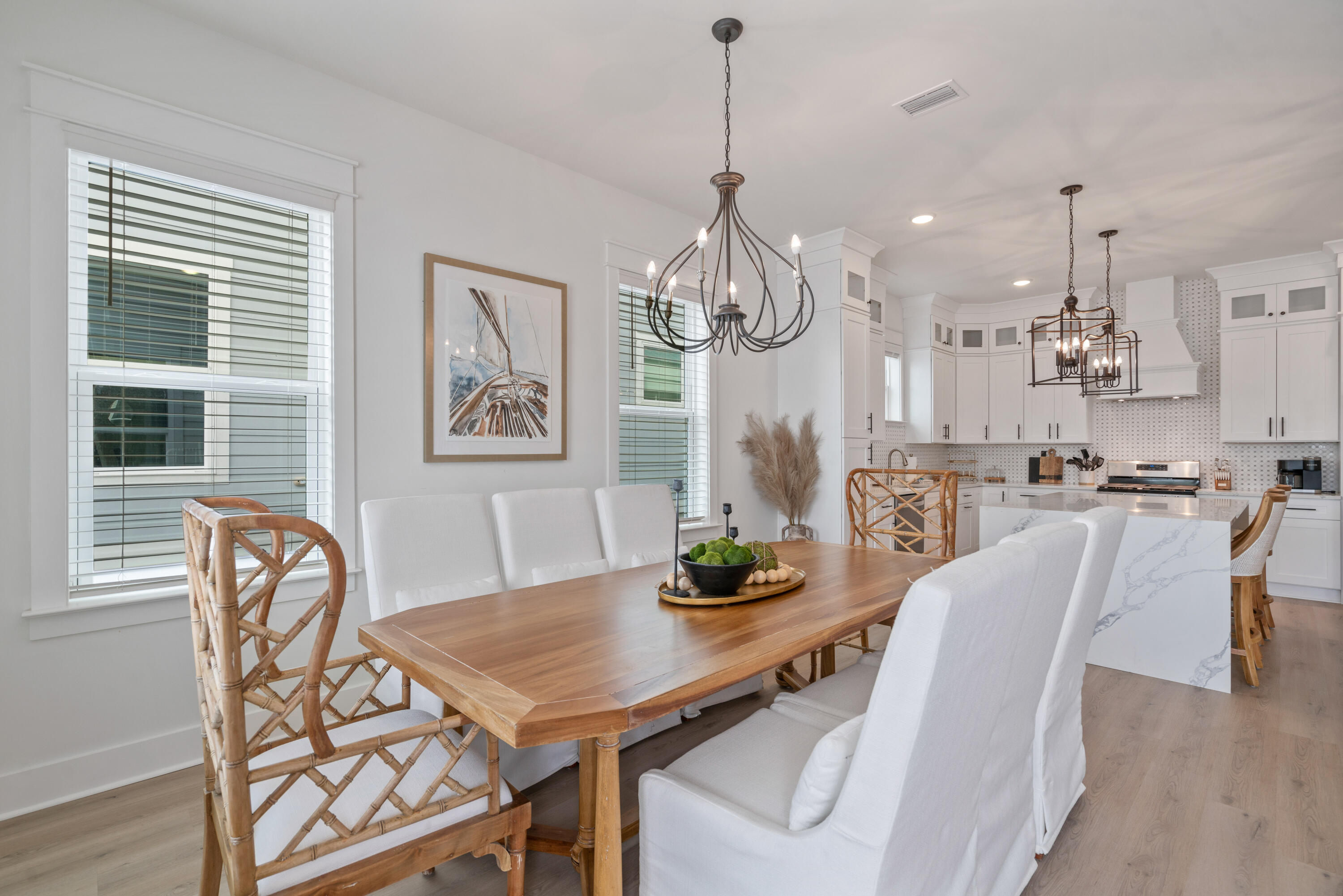 49 Conscience Way Santa Rosa Beach, FL 32459 - Photo 17 of 50 a view of a dining room with furniture a chandelier and wooden floor