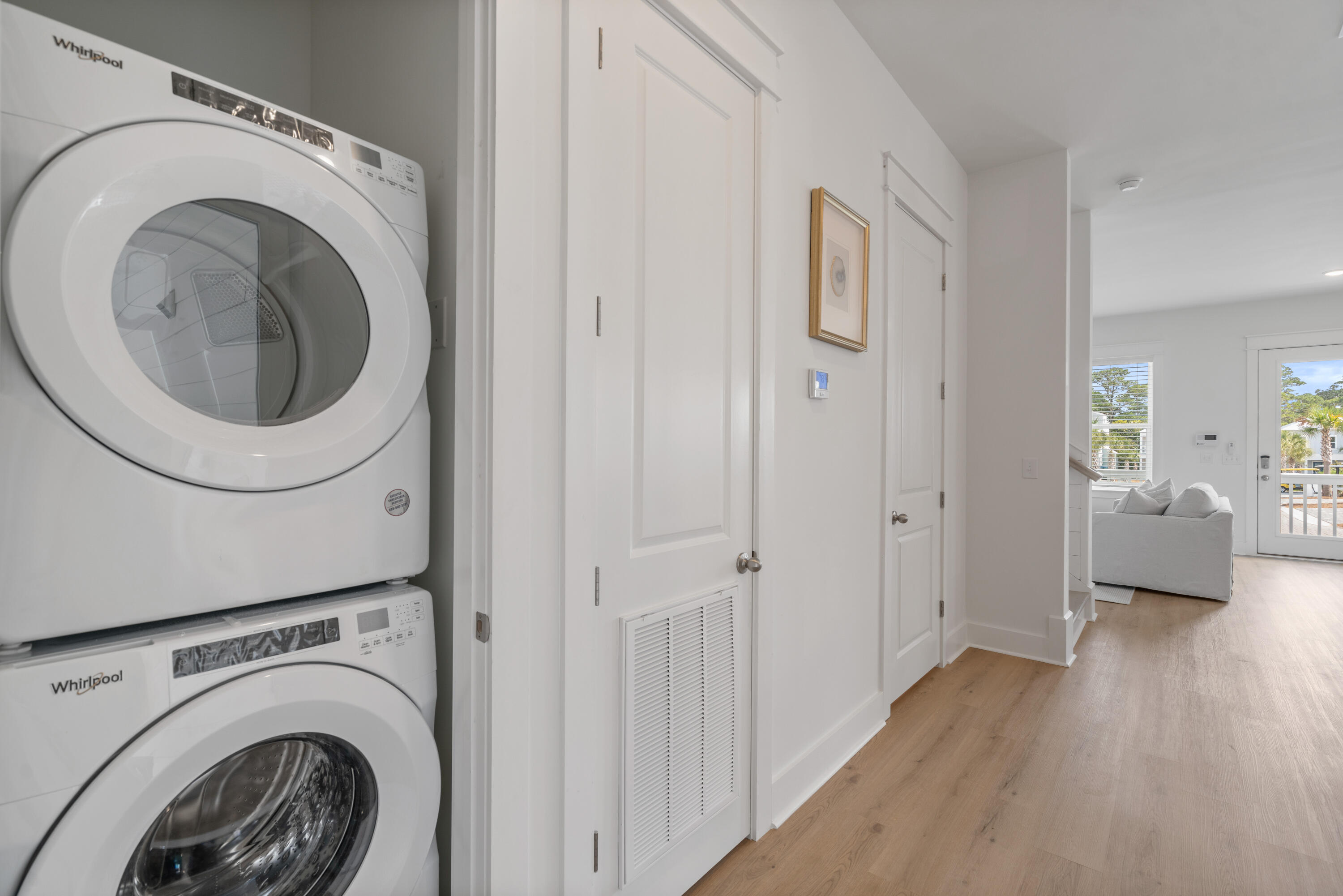 49 Conscience Way Santa Rosa Beach, FL 32459 - Photo 20 of 50 a view of a hallway with washer and dryer