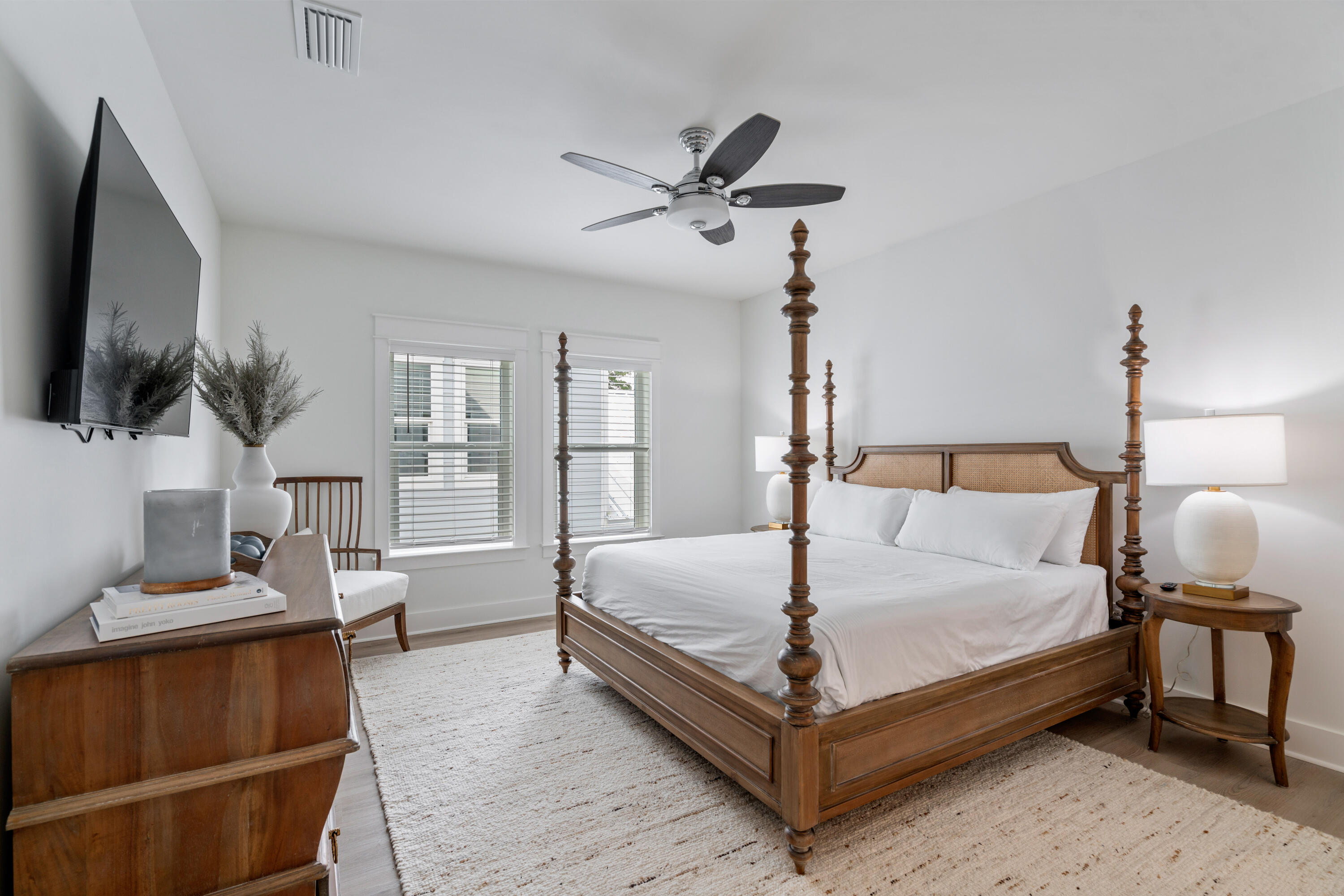 49 Conscience Way Santa Rosa Beach, FL 32459 - Photo 34 of 50 a bedroom with a bed and a flat tv screen on wall