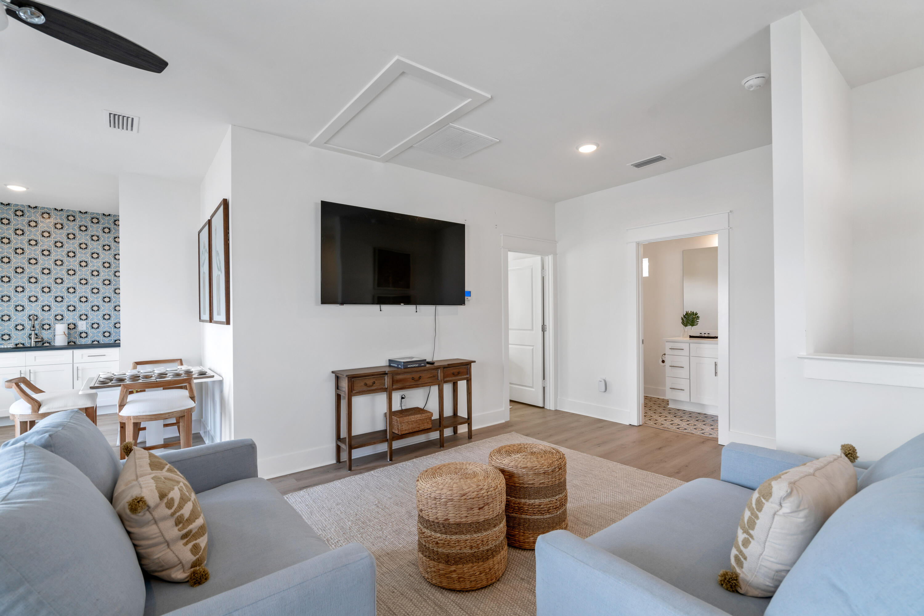 49 Conscience Way Santa Rosa Beach, FL 32459 - Photo 38 of 50 a living room with furniture and a flat screen tv